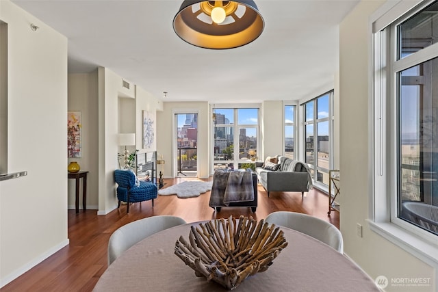 2721 1st Ave Unit 1101, Seattle, WA 98121 - dining room featuring wood finished floors, healthy amount of natural light, and a view of city