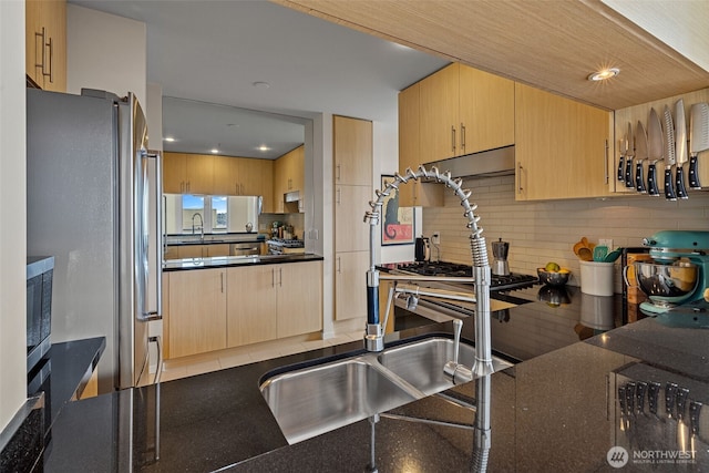 2721 1st Ave Unit 1101, Seattle, WA 98121 - kitchen with freestanding refrigerator, tasteful backsplash, light brown cabinetry, recessed lighting, and under cabinet range hood