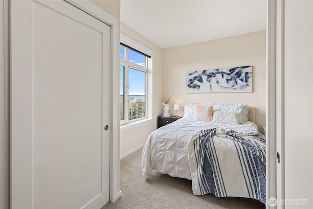 2721 1st Ave Unit 1101, Seattle, WA 98121 - bedroom featuring light carpet and baseboards
