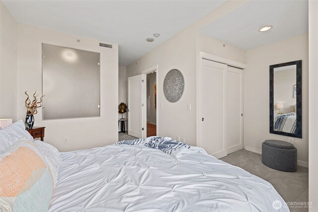 2721 1st Ave Unit 1101, Seattle, WA 98121 - bedroom featuring carpet floors, a closet, and recessed lighting