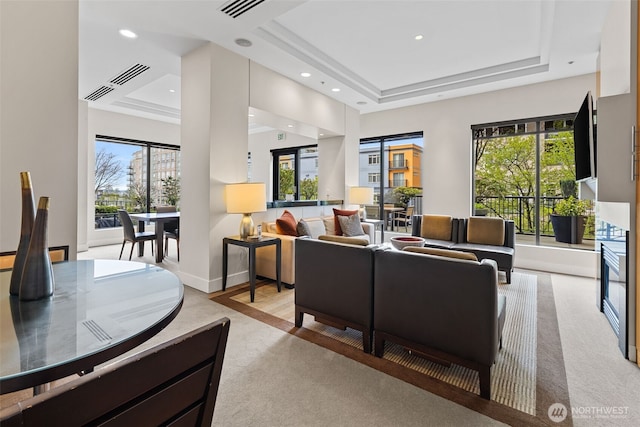 2721 1st Ave Unit 1101, Seattle, WA 98121 - living area with a raised ceiling, plenty of natural light, light carpet, and recessed lighting