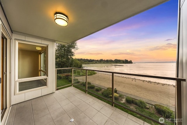 9727 NE Juanita Dr Unit 308, Kirkland, WA 98034 - balcony at dusk with a water view