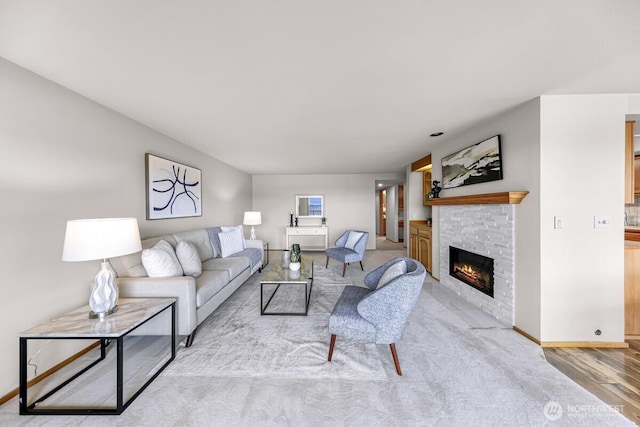 9727 NE Juanita Dr Unit 308, Kirkland, WA 98034 - living area with a fireplace and wood finished floors