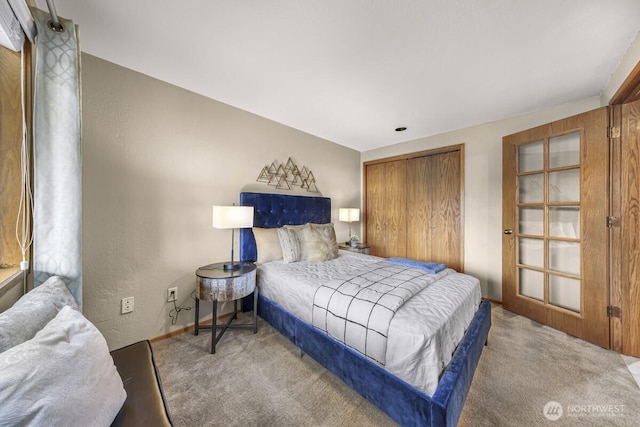 9727 NE Juanita Dr Unit 308, Kirkland, WA 98034 - carpeted bedroom featuring a closet and a textured wall