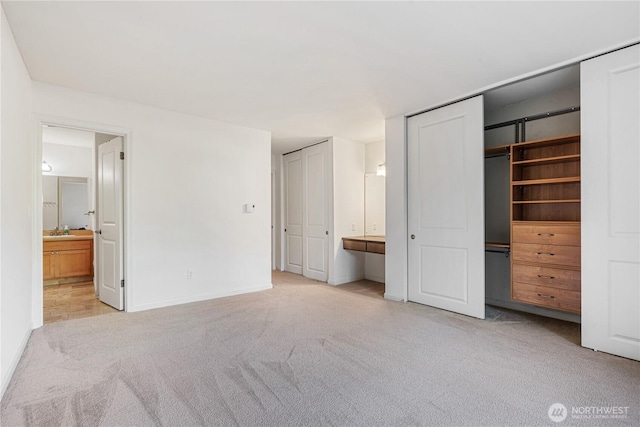 6405 Sand Point Way NE, Seattle, WA 98115 - unfurnished bedroom with multiple closets, carpet floors, and connected bathroom