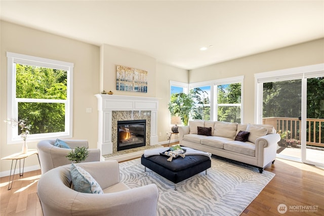 1501 209th Ave NE, Sammamish, WA 98074 - living area with healthy amount of natural light, wood finished floors, and a fireplace