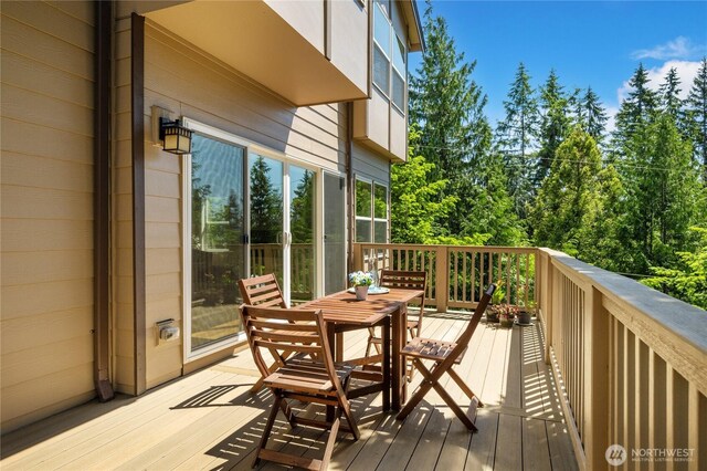 1501 209th Ave NE, Sammamish, WA 98074 - deck with outdoor dining space and view of wooded area