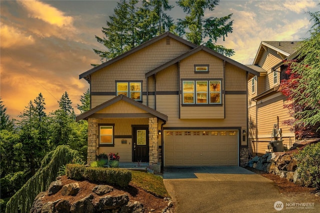 1501 209th Ave NE, Sammamish, WA 98074 - craftsman house featuring stone siding, a garage, concrete driveway, and covered porch