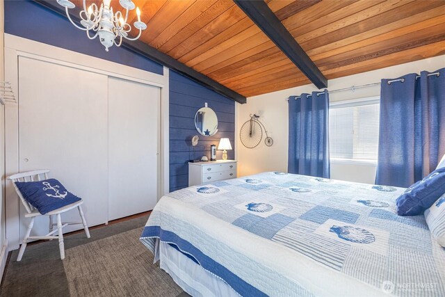 4421 Sucia Dr, Ferndale, WA 98248 - bedroom with wooden ceiling, a chandelier, a closet, and wood walls