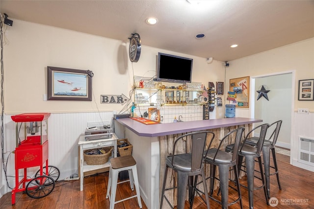 4421 Sucia Dr, Ferndale, WA 98248 - indoor wet bar featuring wood finished floors, a wainscoted wall, and recessed lighting
