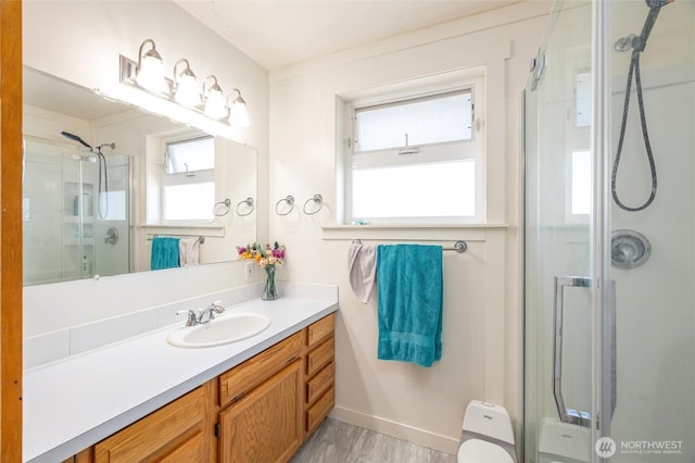 4421 Sucia Dr, Ferndale, WA 98248 - full bath featuring a stall shower, vanity, and wood finished floors