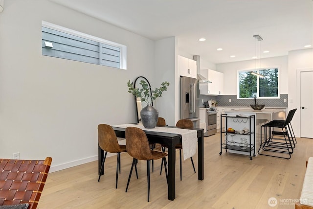 1323 N 185th St Unit A, Shoreline, WA 98133 - dining area with light wood-style flooring and recessed lighting