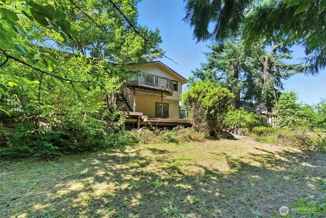 2417 179th Ave E, Lake Tapps, WA 98391 - view of green lawn with a wooden deck and stairway