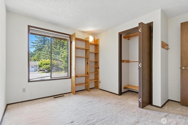 2417 179th Ave E, Lake Tapps, WA 98391 - unfurnished bedroom with carpet floors and a textured ceiling