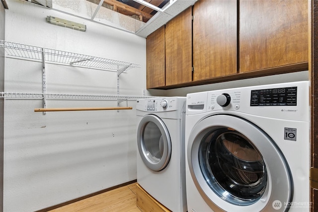2417 179th Ave E, Lake Tapps, WA 98391 - laundry area with cabinet space, light wood finished floors, and independent washer and dryer