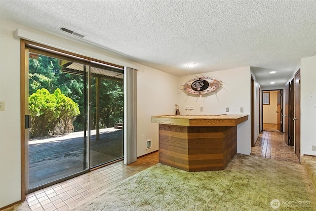 2417 179th Ave E, Lake Tapps, WA 98391 - indoor wet bar featuring tile patterned floors, a textured ceiling, and recessed lighting