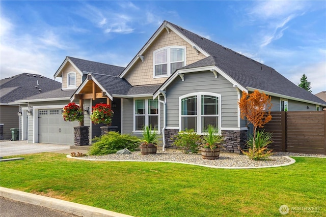1118 26th St NW, Puyallup, WA 98373 - craftsman-style house with stone siding, an attached garage, a shingled roof, and driveway
