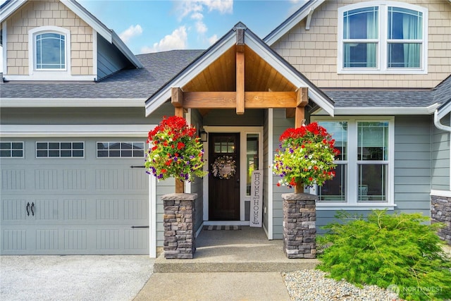1118 26th St NW, Puyallup, WA 98373 - doorway to property with a shingled roof, an attached garage, and concrete driveway