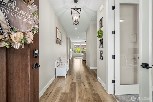 1118 26th St NW, Puyallup, WA 98373 - hallway featuring light wood-style flooring, recessed lighting, and a chandelier