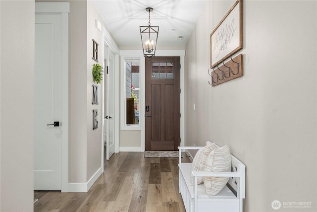 1118 26th St NW, Puyallup, WA 98373 - foyer with a chandelier and light wood finished floors