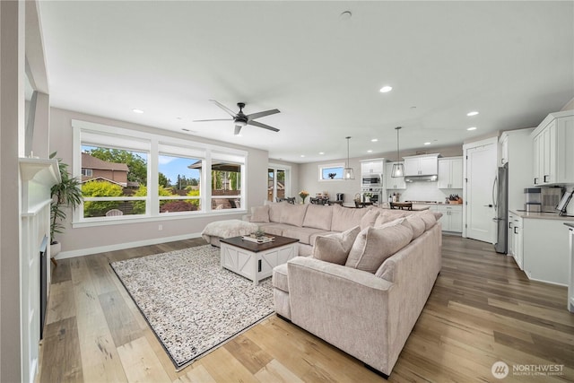 1118 26th St NW, Puyallup, WA 98373 - living area featuring recessed lighting, healthy amount of natural light, wood finished floors, and a ceiling fan