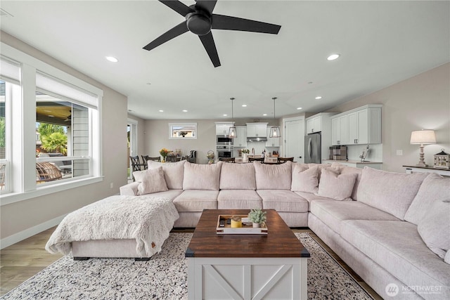 1118 26th St NW, Puyallup, WA 98373 - living room with recessed lighting, ceiling fan, and light wood-type flooring