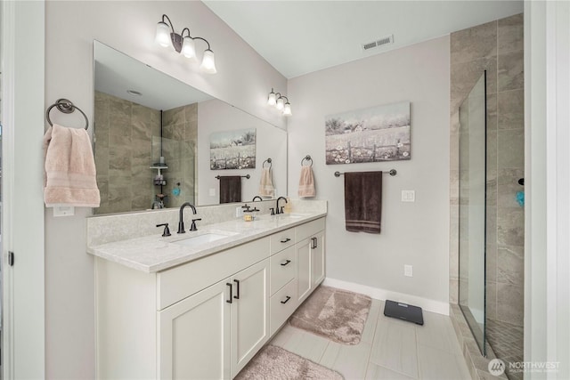 1118 26th St NW, Puyallup, WA 98373 - bathroom featuring double vanity, a tile shower, and tile patterned floors