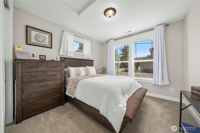 1118 26th St NW, Puyallup, WA 98373 - bedroom with light carpet and baseboards