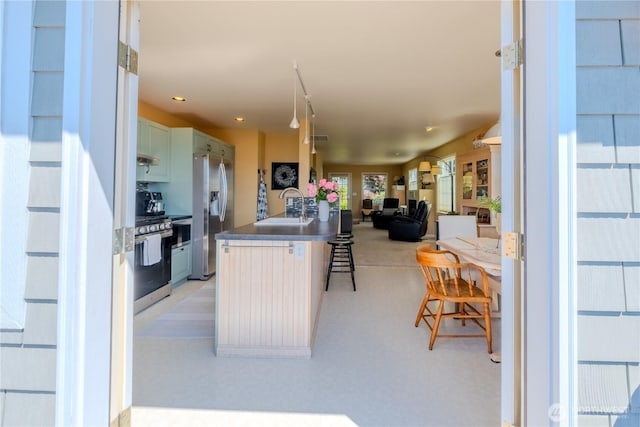 618 12th St, Bellingham, WA 98225 - kitchen featuring stainless steel appliances, a kitchen bar, and open floor plan