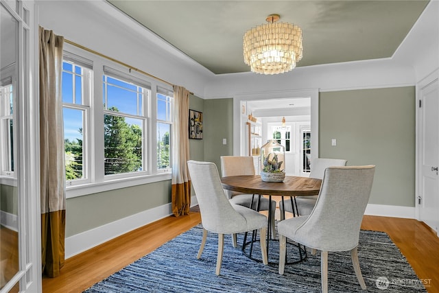 2456 4th Ave W, Seattle, WA 98119 - dining area with a chandelier and wood finished floors