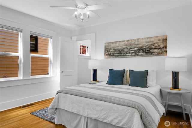 2456 4th Ave W, Seattle, WA 98119 - bedroom with wood finished floors and a ceiling fan