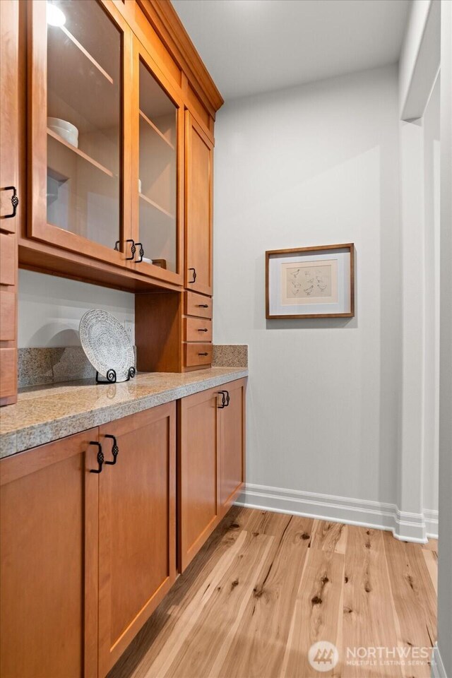 19735 183rd Way SE, Renton, WA 98058 - bar area with light wood-style flooring and baseboards