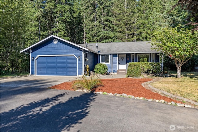 120 E Rd Of Tralee, Shelton, WA 98584 - ranch-style house featuring driveway, an attached garage, and a wooded view