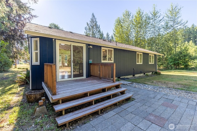120 E Rd Of Tralee, Shelton, WA 98584 - rear view of property featuring roof with shingles, a lawn, and a wooden deck