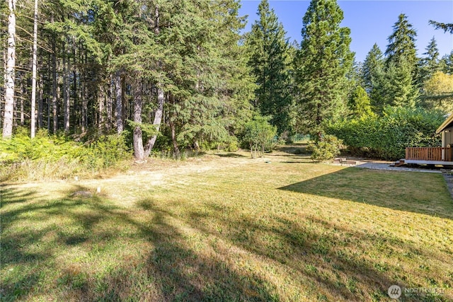 120 E Rd Of Tralee, Shelton, WA 98584 - view of green lawn with a deck and a wooded view