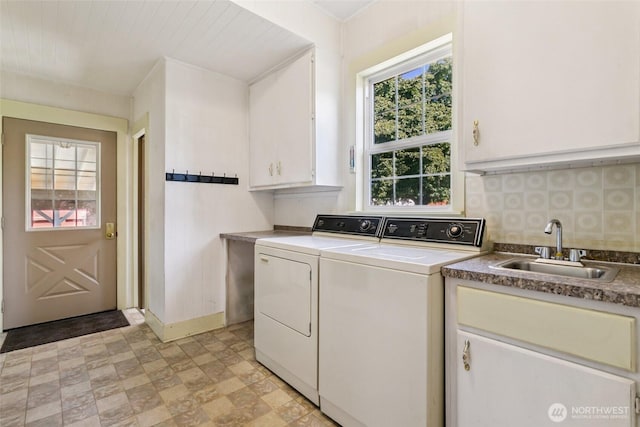 511 N Iron St, Centralia, WA 98531 - laundry area with washer and dryer, cabinet space, and stone finish flooring