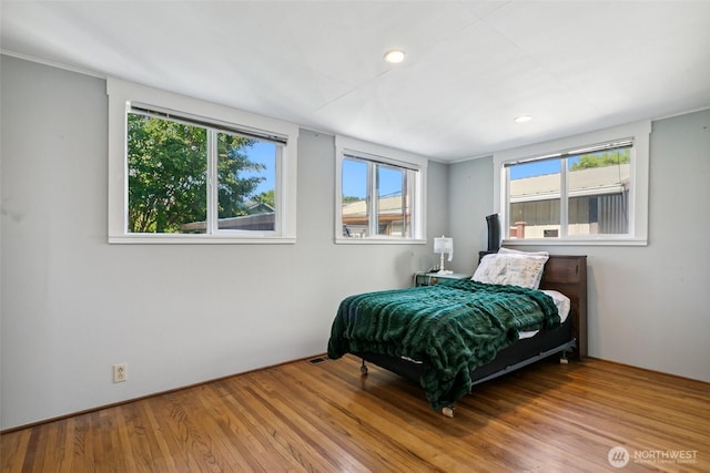 511 N Iron St, Centralia, WA 98531 - bedroom featuring wood finished floors, multiple windows, and recessed lighting