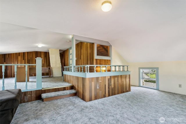 511 N Iron St, Centralia, WA 98531 - additional living space with vaulted ceiling, carpet flooring, and wood walls