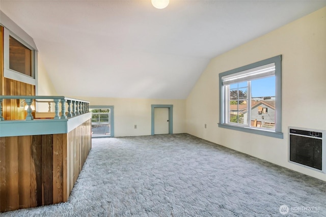 511 N Iron St, Centralia, WA 98531 - unfurnished living room featuring lofted ceiling, carpet floors, heating unit, and healthy amount of natural light
