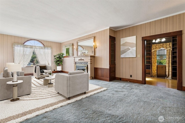 511 N Iron St, Centralia, WA 98531 - carpeted living room with wallpapered walls, ornamental molding, and a fireplace