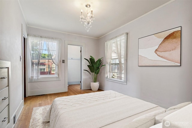 511 N Iron St, Centralia, WA 98531 - bedroom with ornamental molding, a chandelier, and wood finished floors