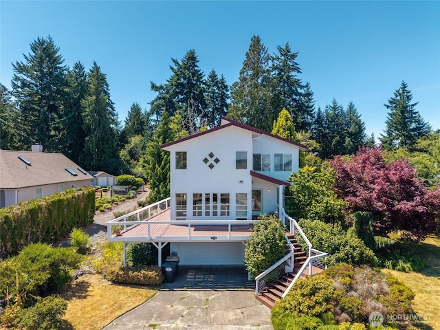 5225 Illahee Ln NE, Olympia, WA 98516 - view of front of property featuring a garage, concrete driveway, and stairs