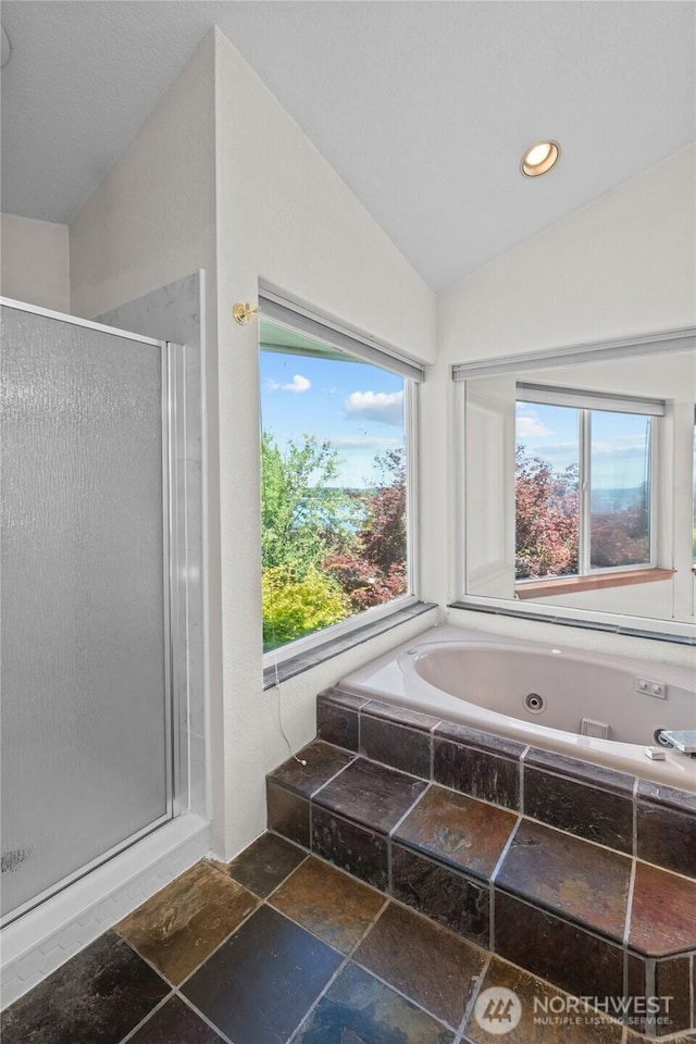 5225 Illahee Ln NE, Olympia, WA 98516 - bathroom featuring a stall shower, plenty of natural light, a whirlpool tub, vaulted ceiling, and stone finish floors