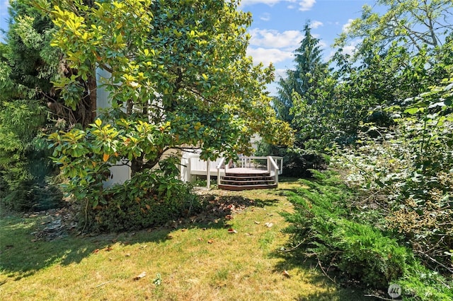 5225 Illahee Ln NE, Olympia, WA 98516 - view of green lawn featuring a wooden deck