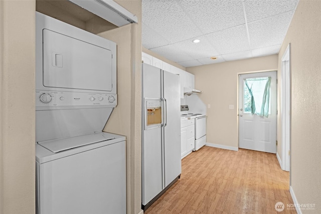 5225 Illahee Ln NE, Olympia, WA 98516 - laundry room with stacked washer / drying machine and light wood-type flooring
