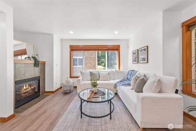 2511 NE 125th St Unit A, Seattle, WA 98125 - living area with wood finished floors, a tile fireplace, and recessed lighting