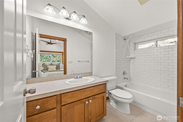 2511 NE 125th St Unit A, Seattle, WA 98125 - ensuite bathroom with vaulted ceiling, vanity, shower / tub combination, and tile patterned floors