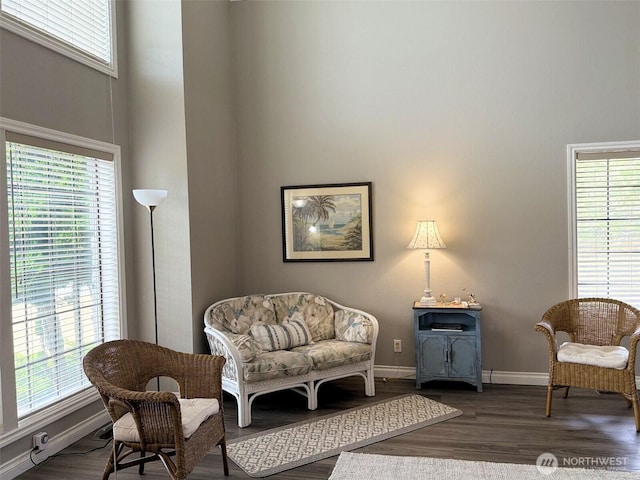 598 Blue Wing Loop SE, Ocean Shores, WA 98569 - sitting room featuring healthy amount of natural light, dark wood finished floors, and a high ceiling