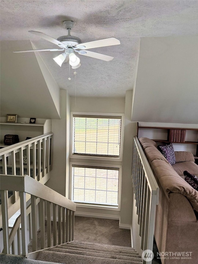 598 Blue Wing Loop SE, Ocean Shores, WA 98569 - stairs with a textured ceiling, carpet flooring, and a ceiling fan