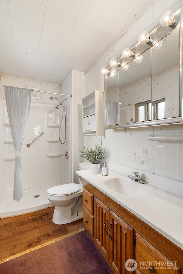 2507 Bay Ave, Hoquiam, WA 98550 - full bathroom with a shower, vanity, and wood finished floors